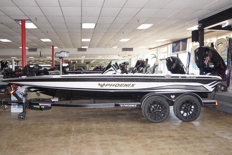 The Image of 2026 Phoenix 920 Elite X boat displayed indoors on a trailer. - 0