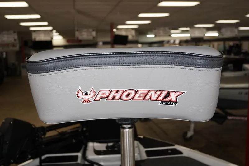 Slide: The Image of Phoenix 920 Elite X 2026 boat seat with logo in showroom setting. - 12