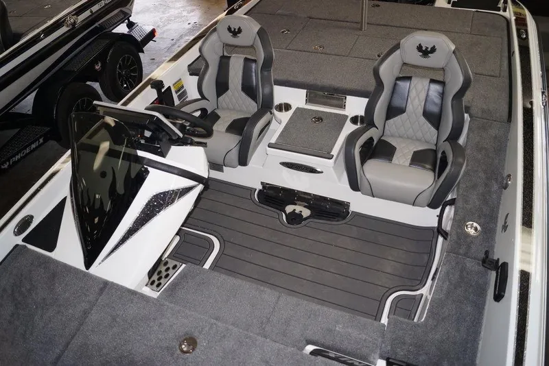 Slide: The Image of Interior of 2026 Phoenix 920 Elite X boat with dual seats and sleek design. - 18