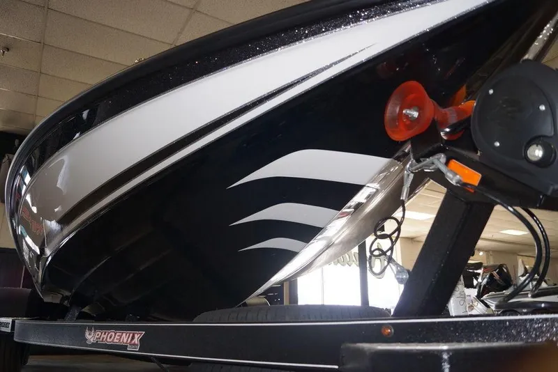 Slide: The Image of 2026 Phoenix 920 Elite X boat on trailer, showcasing sleek design and modern features. - 2