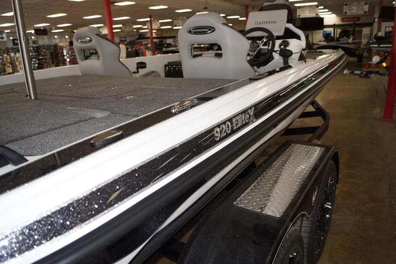 Slide: The Image of 2026 Phoenix 920 Elite X boat interior with Garmin equipment in showroom. - 21