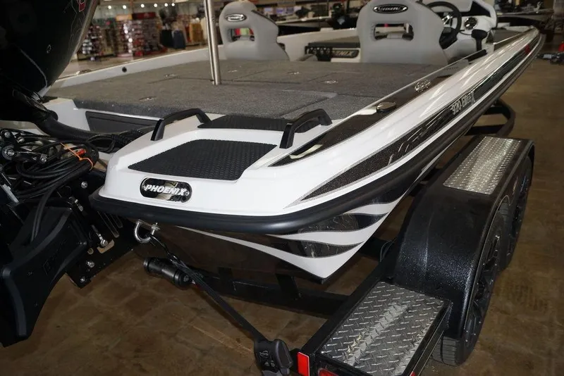 Slide: The Image of 2026 Phoenix 920 Elite X boat on trailer, showcasing sleek design and modern features. - 22