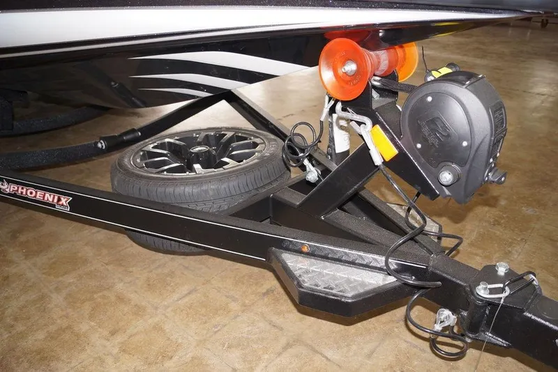 Slide: The Image of Trailer hitch of 2026 Phoenix 920 Elite X boat with tire and winch. - 5