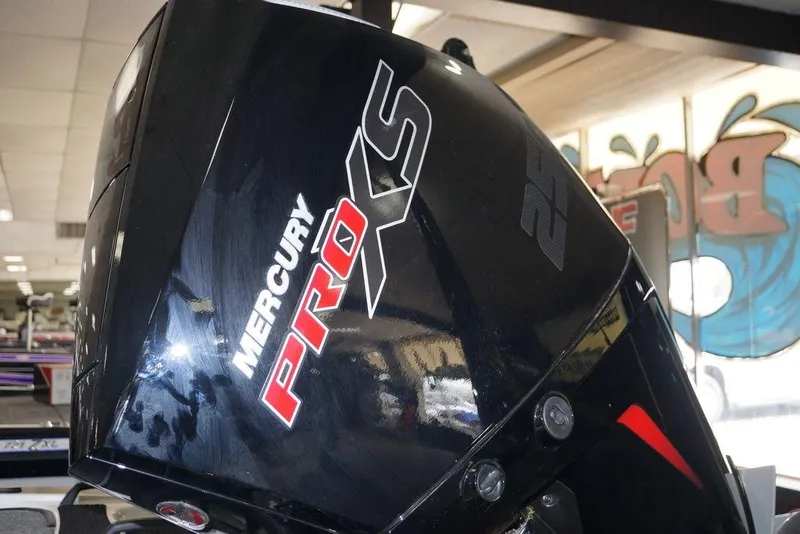 Slide: The Image of Mercury Pro XS engine on a 2026 Phoenix 920 Elite X boat in showroom. - 8