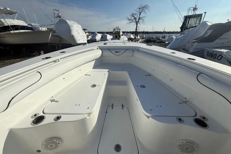 Slide: The Image of 2017 Sea Hunt Gamefish 30 boat interior, showcasing spacious seating and storage areas. - 10