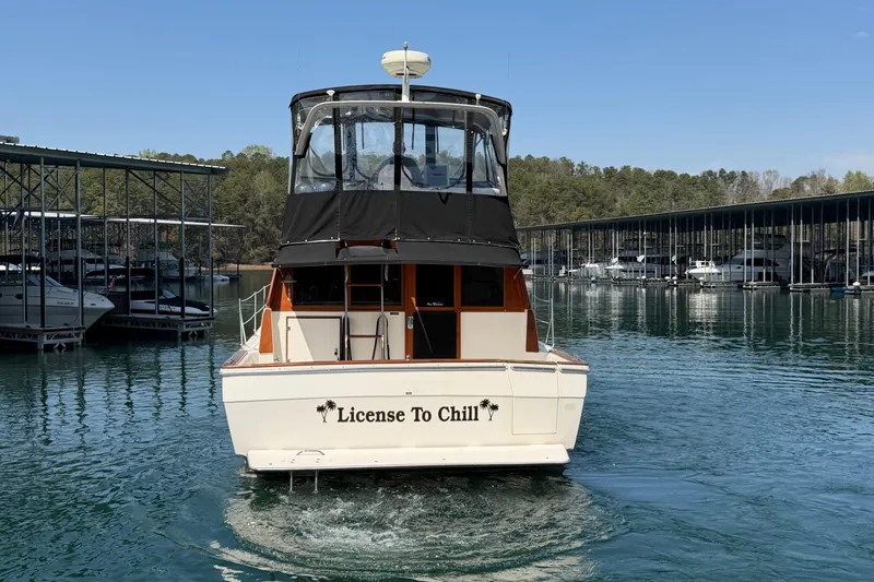 Slide: The Image of 1994 Bayliner 3888 MY Sedan boat named "License To Chill" docked in a marina. - 20