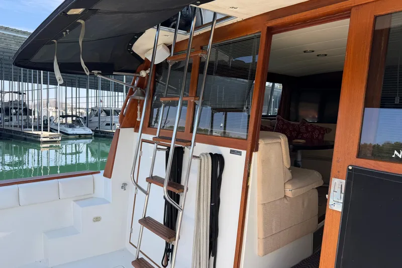 Slide: The Image of 1994 Bayliner 3888 MY Sedan interior with ladder and marina view. - 26