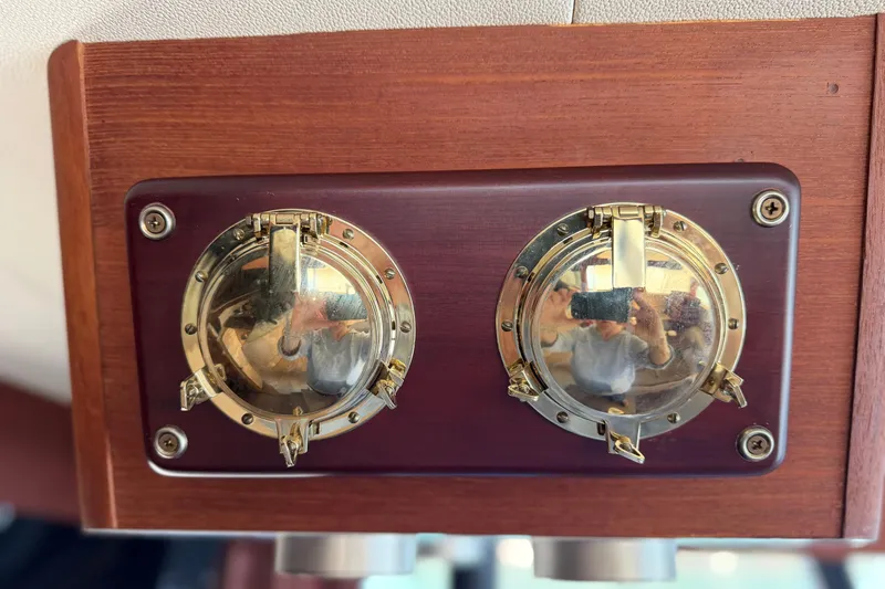 Slide: The Image of Brass nautical gauges on 1994 Bayliner 3888 MY Sedan's wooden panel. - 39