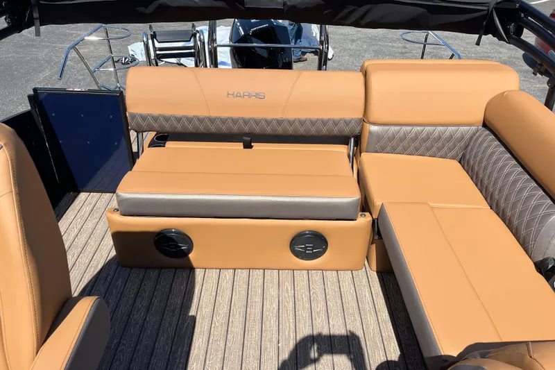 Slide: The Image of Luxurious seating on 2026 Harris Cruiser 230 SL boat with tan upholstery. - 10