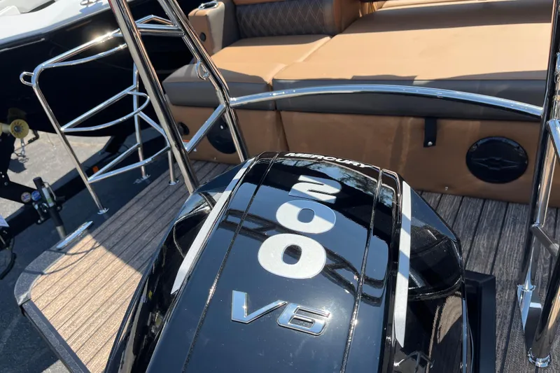 Slide: The Image of 2026 Harris Cruiser 230 SL with Mercury 200 V6 engine, featuring sleek design and seating. - 4