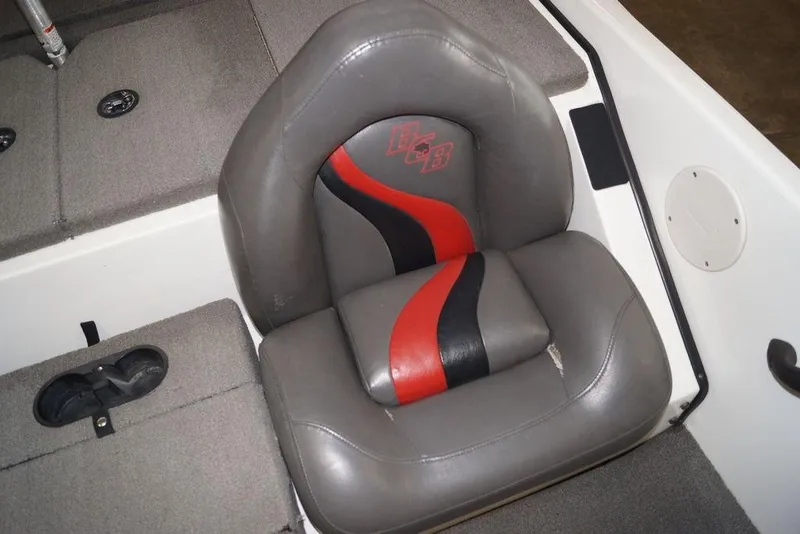 Slide: The Image of 2018 Bass Cat Pantera II boat seat with red and black accents. - 14