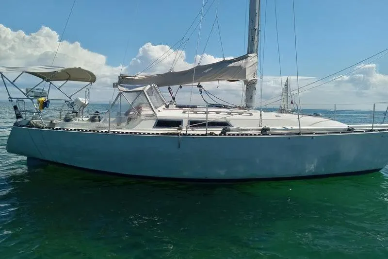 The Image of 1979 C & C 36-1 sailboat on calm sea under clear sky. - 0