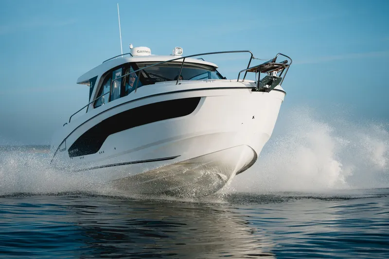 Slide: The Image of 2025 Beneteau Antares 9 cruising on water, showcasing sleek design and performance. - 6