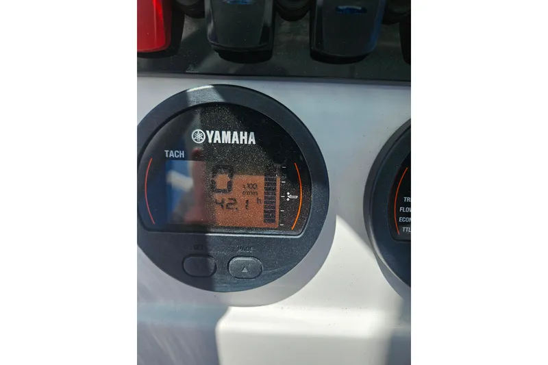 Slide: The Image of Yamaha tachometer on 2023 Sea Hunt Ultra 229 boat dashboard displaying RPM. - 24