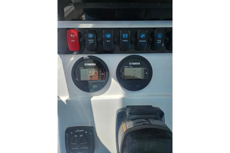 Slide: The Image of Control panel of 2023 Sea Hunt Ultra 229 boat with Yamaha gauges and switches. - 25