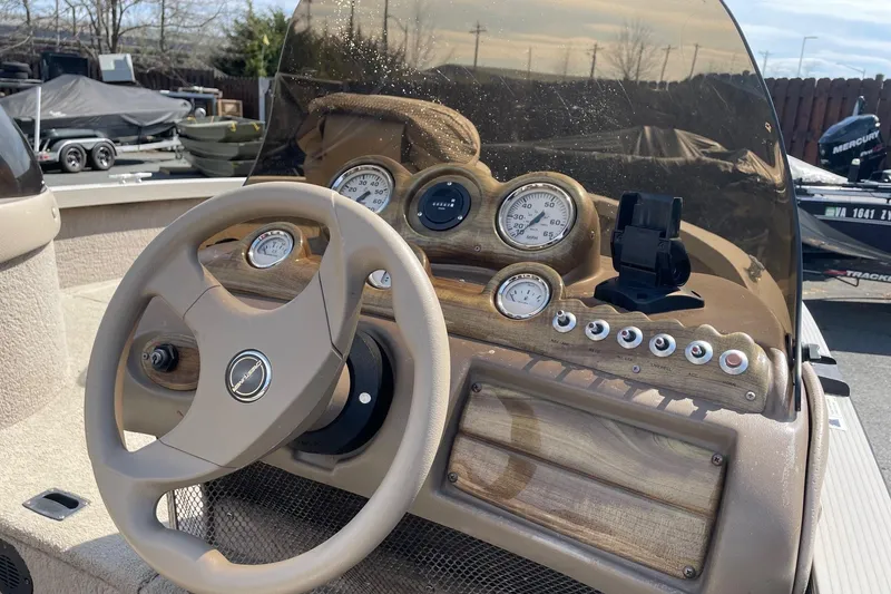 Slide: The Image of Steering console of 2003 Crestliner 1850 Fish Hawk SC boat with gauges and controls. - 6