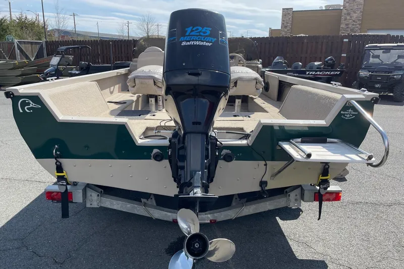 Slide: The Image of 2003 Crestliner 1850 Fish Hawk SC boat with Mercury 125 outboard motor, rear view. - 9