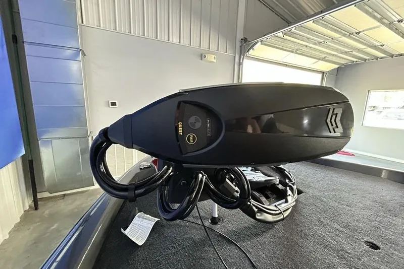 Slide: The Image of 2026 Skeeter ZXE20 boat motor in a garage setting. - 11