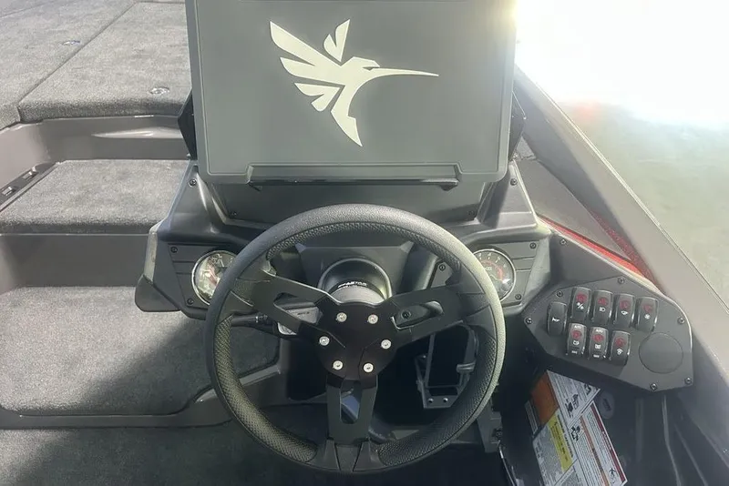 Slide: The Image of 2026 Skeeter ZXE20 boat dashboard with steering wheel and control panel. - 13