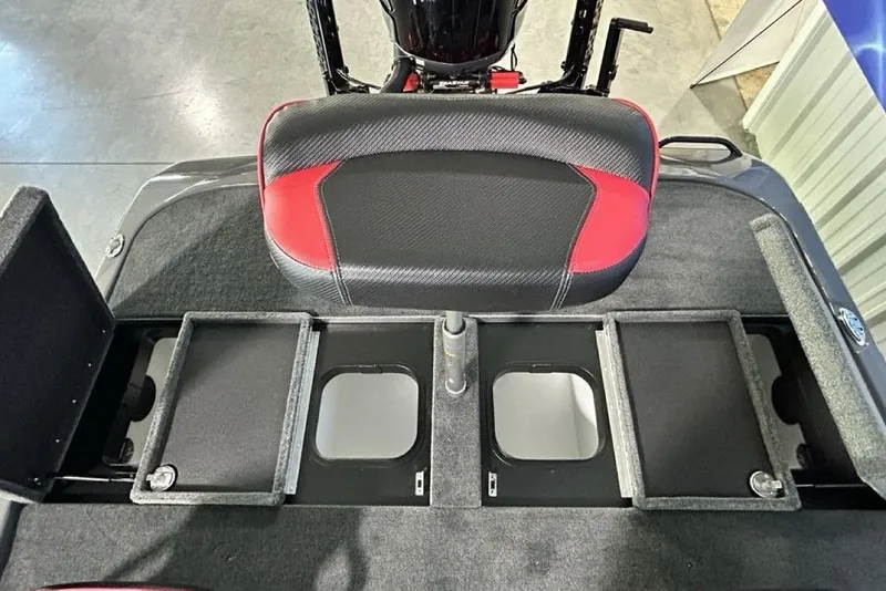 Slide: The Image of 2026 Skeeter ZXE20 boat interior with storage compartments and red-black seat. - 19