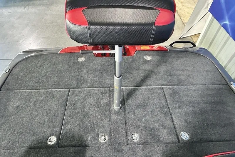 Slide: The Image of 2026 Skeeter ZXE20 boat seat with red and black upholstery on a carpeted deck. - 22