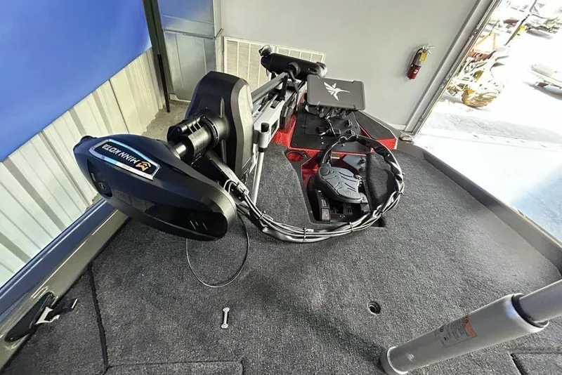 Slide: The Image of 2026 Skeeter ZXE20 boat deck with Minn Kota trolling motor and control panel. - 6