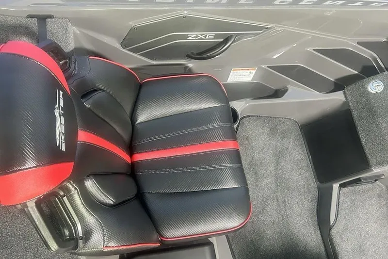 Slide: The Image of Skeeter ZXE20 2026 boat seat with black and red design, featuring logo embroidery. - 8