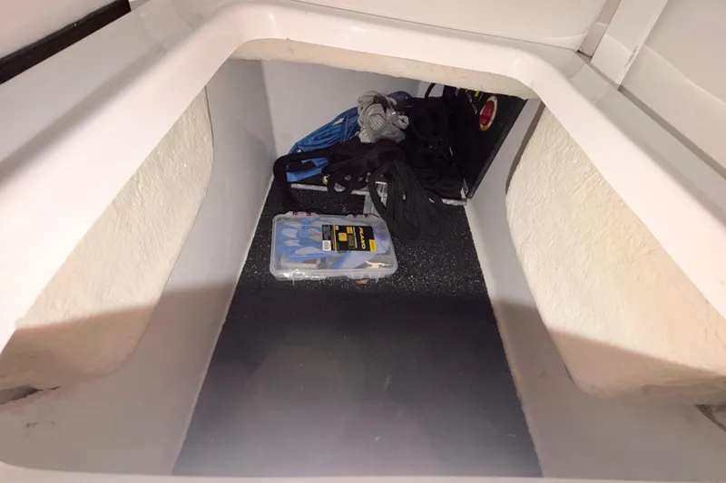 Slide: The Image of Storage compartment in 2023 Regal 26 XO boat with ropes and accessories. - 102