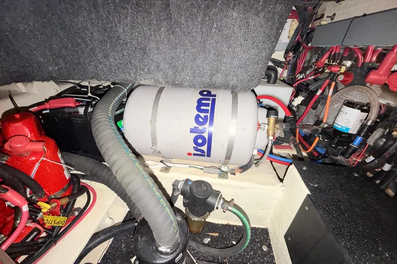 Slide: The Image of Engine compartment of 2023 Regal 26 XO boat with Isotemp water heater. - 103