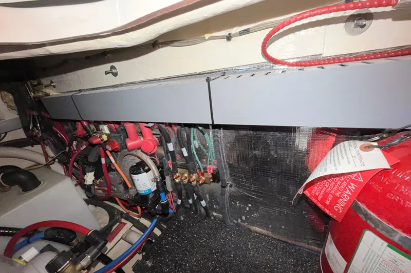 Slide: The Image of Electrical and mechanical components inside a 2023 Regal 26 XO boat. - 104