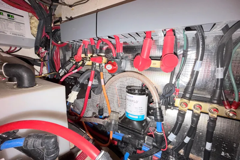 Slide: The Image of Electrical and plumbing system inside a 2023 Regal 26 XO boat. - 106