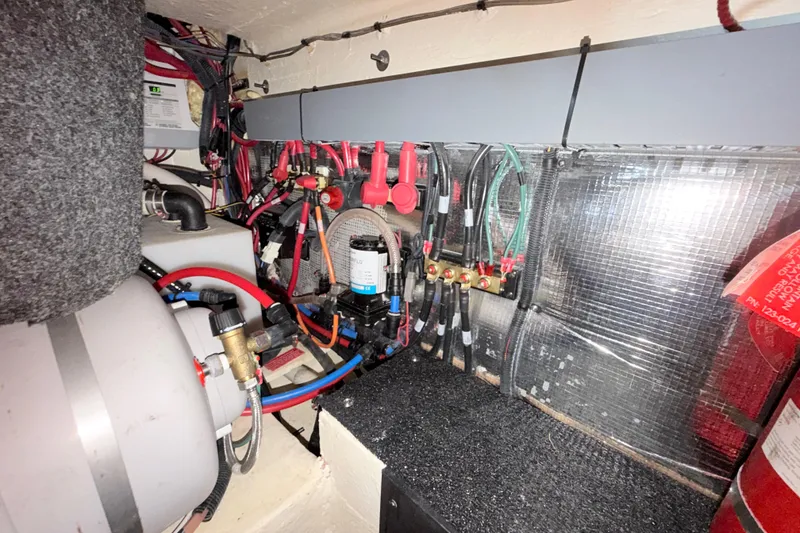 Slide: The Image of Electrical and plumbing systems inside a 2023 Regal 26 XO boat. - 108