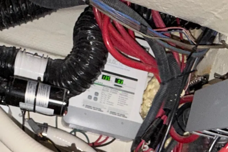 Slide: The Image of Electrical wiring and components inside a 2023 Regal 26 XO boat. - 111