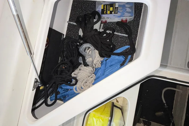 Slide: The Image of Storage compartment in 2023 Regal 26 XO boat with ropes and accessories. - 113