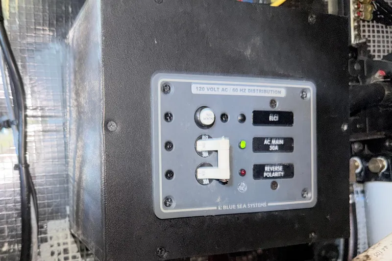 Slide: The Image of Electrical panel on 2023 Regal 26 XO boat, featuring Blue Sea Systems components. - 115