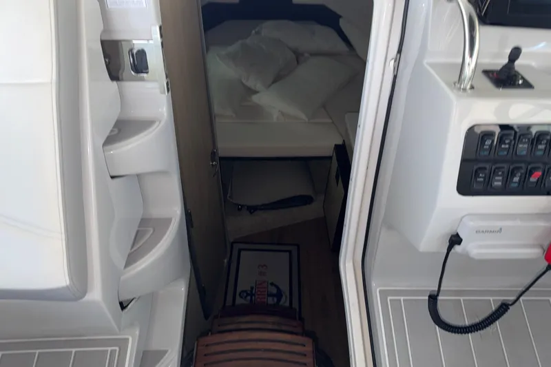Slide: The Image of Interior view of 2023 Regal 26 XO boat cabin with control panel. - 117