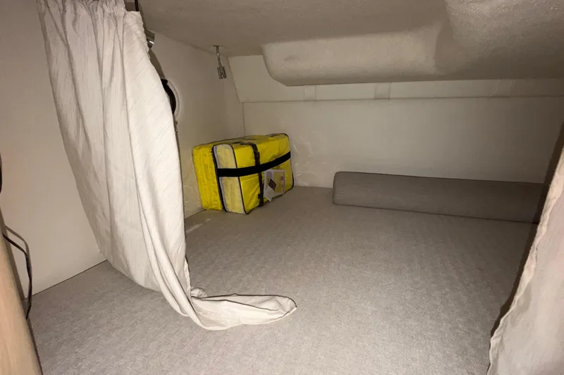 Slide: The Image of Interior cabin of 2023 Regal 26 XO boat with storage and curtain. - 132
