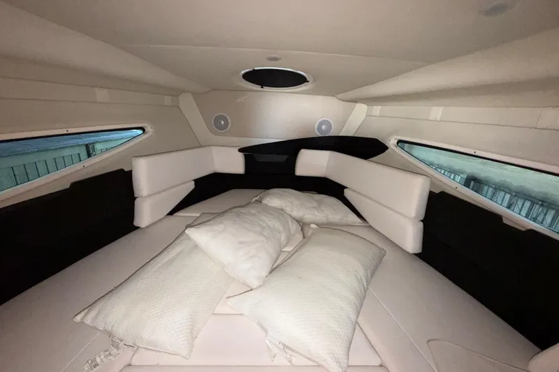 Slide: The Image of Interior cabin of 2023 Regal 26 XO boat with cushions and windows. - 134