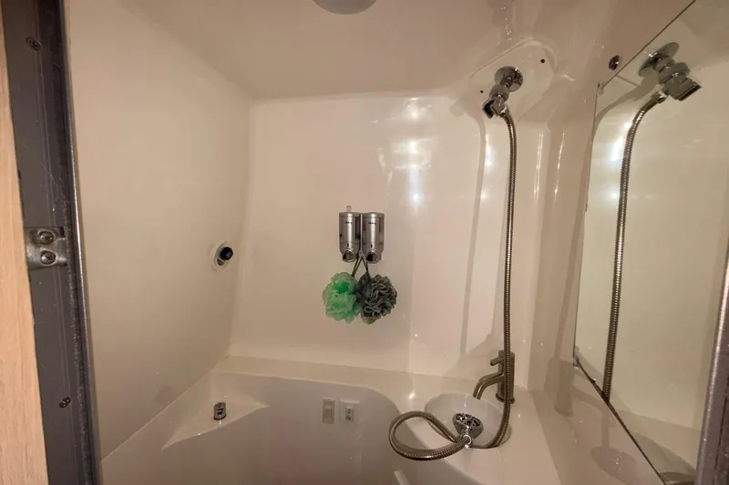 Slide: The Image of 2023 Regal 26 XO boat bathroom with shower and mirror. - 138
