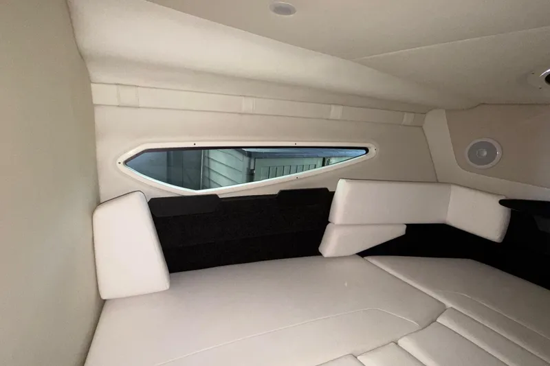 Slide: The Image of Interior cabin of 2023 Regal 26 XO boat with modern seating and window. - 141