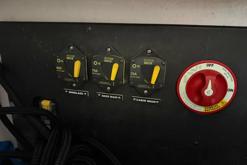 Slide: The Image of Electrical panel of 2023 Regal 26 XO boat with circuit breakers and battery switch. - 147