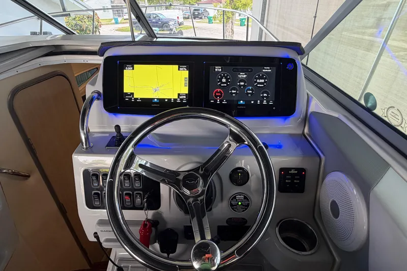 Slide: The Image of 2023 Regal 26 XO boat dashboard with navigation and control systems. - 151