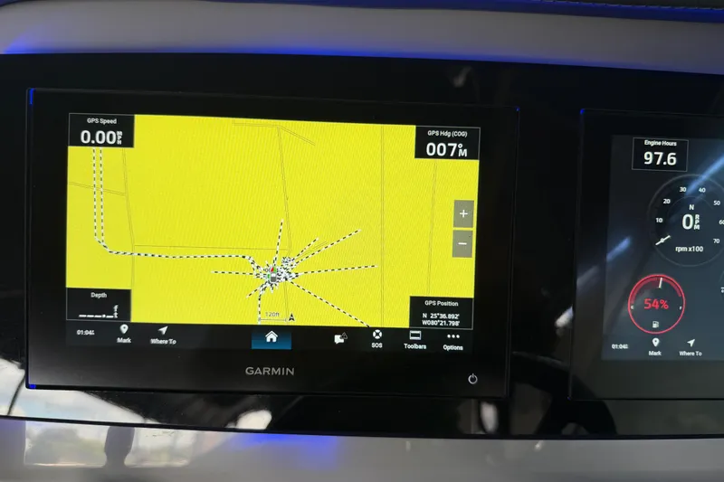 Slide: The Image of Garmin GPS display on 2023 Regal 26 XO boat dashboard, showing navigation and engine data. - 153