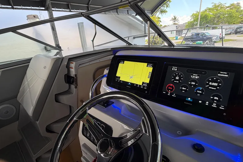 Slide: The Image of 2023 Regal 26 XO boat dashboard with advanced navigation and control displays. - 155
