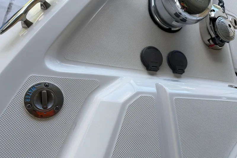 Slide: The Image of 2023 Regal 26 XO boat dashboard with water access and control panel. - 158