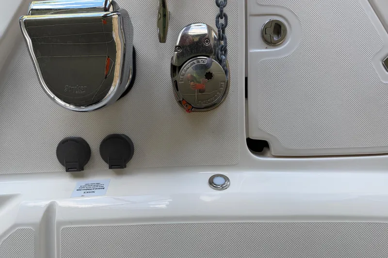 Slide: The Image of 2023 Regal 26 XO boat deck with chrome fittings and chain mechanism. - 166