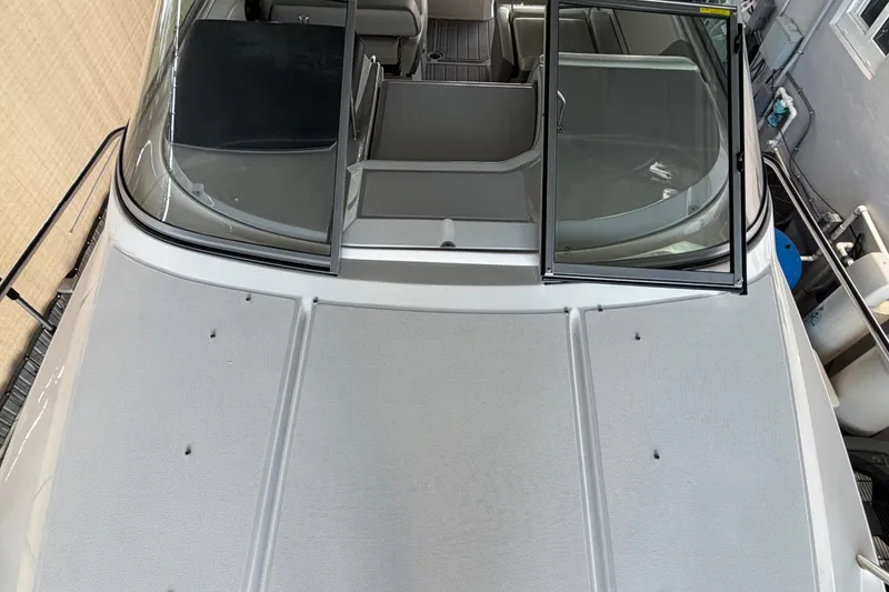 Slide: The Image of 2023 Regal 26 XO boat with open windshield, showcasing sleek design and spacious interior. - 172