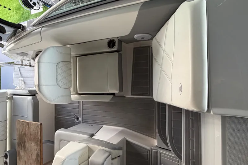 Slide: The Image of 2023 Regal 26 XO boat interior with white seating and modern design. - 173