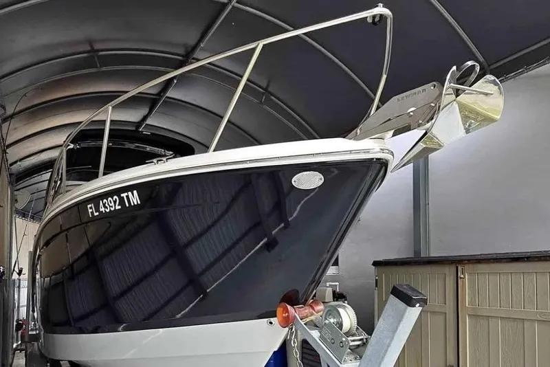 Slide: The Image of 2023 Regal 26 XO boat in storage, featuring sleek design and modern amenities. - 18