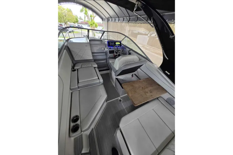 Slide: The Image of Interior of 2023 Regal 26 XO boat with seating and helm under canopy. - 19